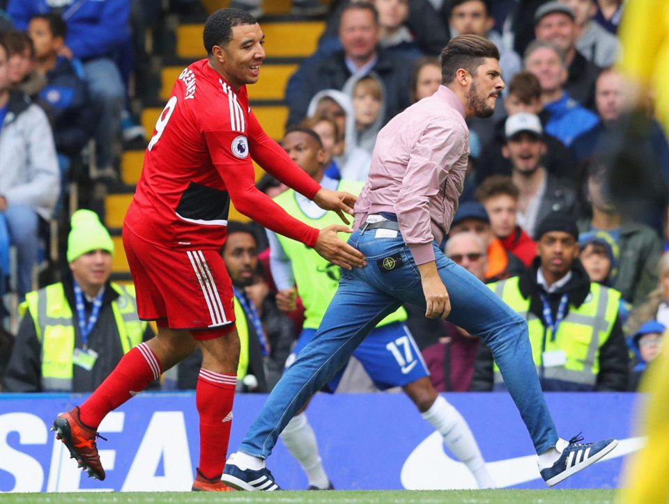  Troy Deeney got a good feel of a pitch invader at Chelsea