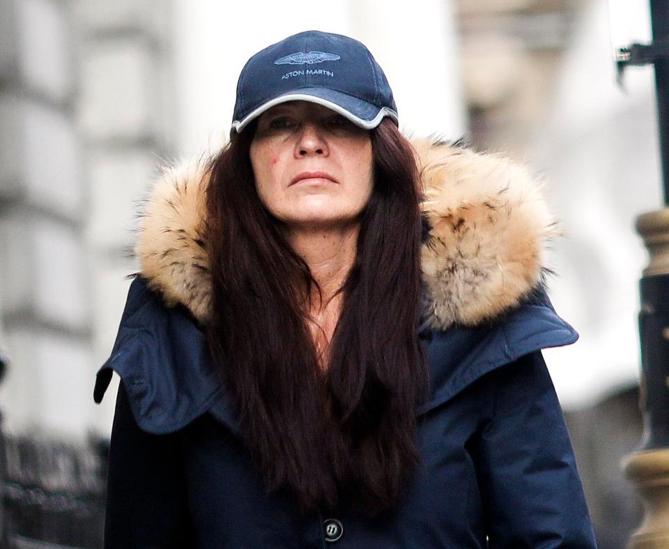  The wife of Kate Middleton uncle covered her face in an Aston Martin baseball cap and a parka jacket