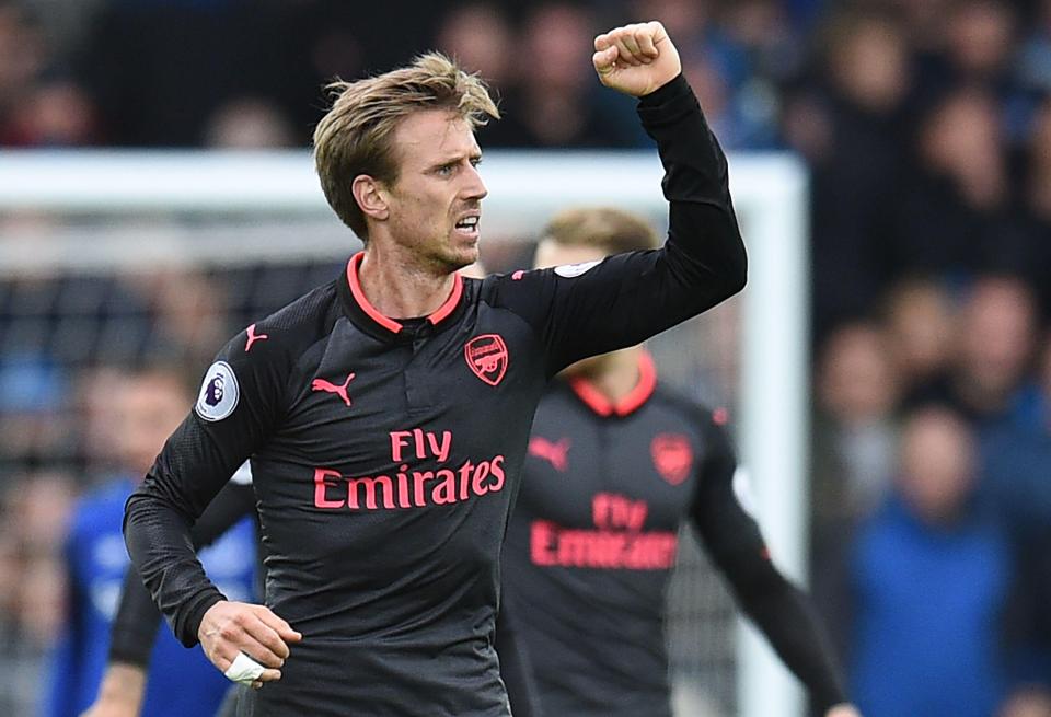  Monreal celebrates after making it 1-1 against Everton