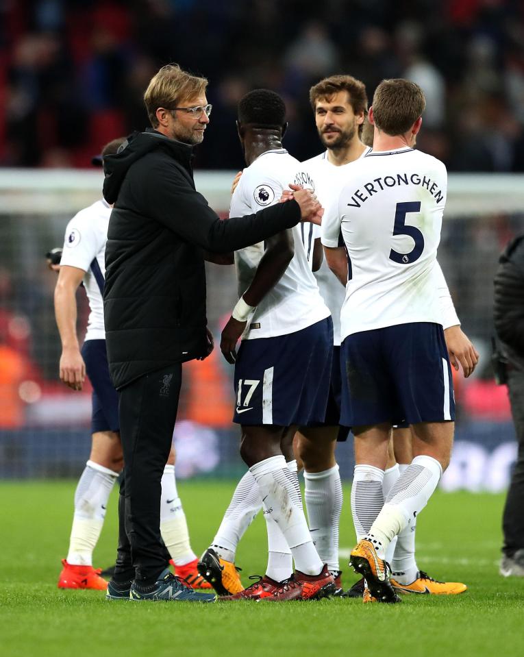  Jurgen Klopp congratulates the Tottenham players: perhaps he should concentrate on his own defensive problems