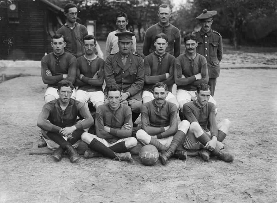  The football team of the Third Army Trench Mortar School pose for a group photograph in Saint-Pol-sur-Ternoise close to the Western Front, May 1917