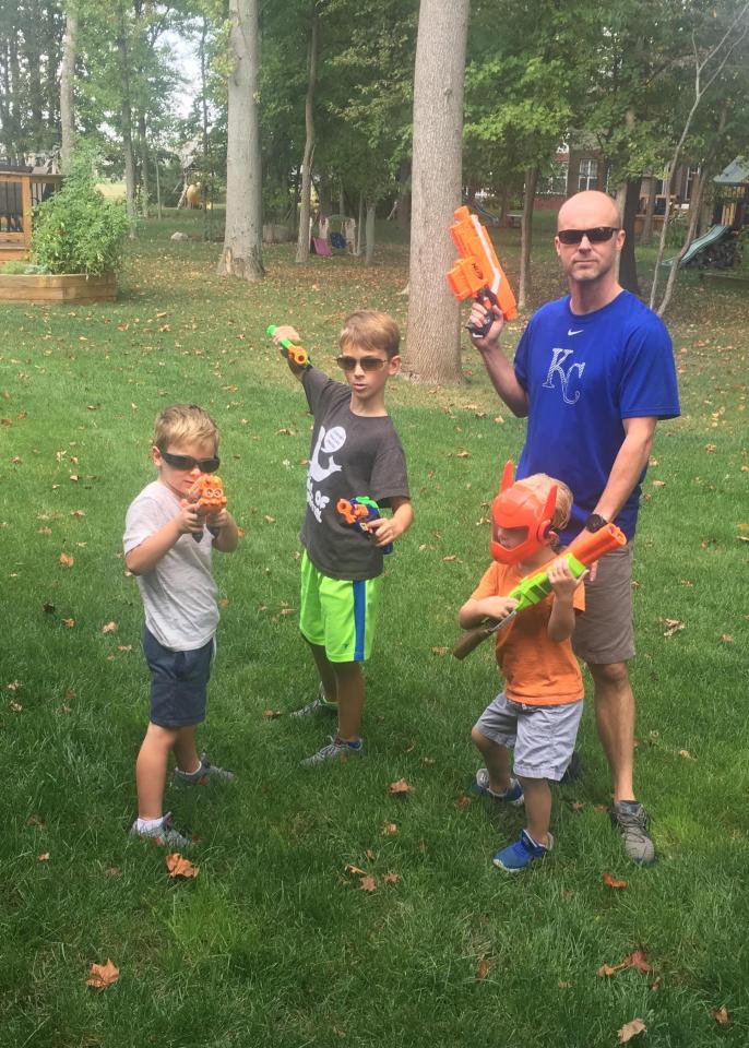  Steve with his three sons. Charlie is pictured on the far left