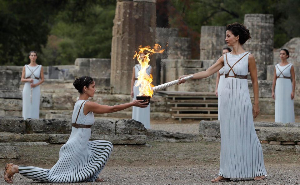 Greek actress Katerina Lechou, playing the role of the High Priestess, lights the Olympic Flame torch in rehearsal for the Lighting Ceremony in South Korea to launch the Winter Olympics