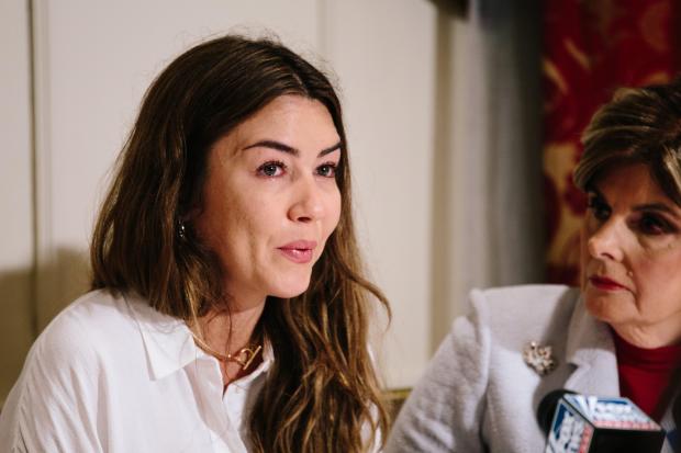 Mimi Haleyi, left, sits with attorney Gloria Allred, right, during a press conference where Haleyi detailed an alleged sexual assault by movie producer Harvey Weinstein in New York