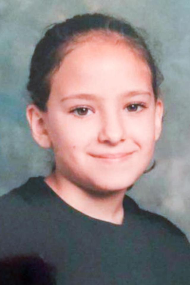  Star Delguidice, aged nine, posing for a school photograph