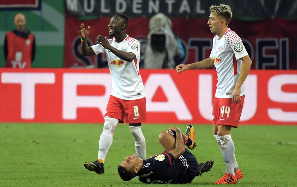  Bayern Munich ace Thiago reacts to a challenge from Keita