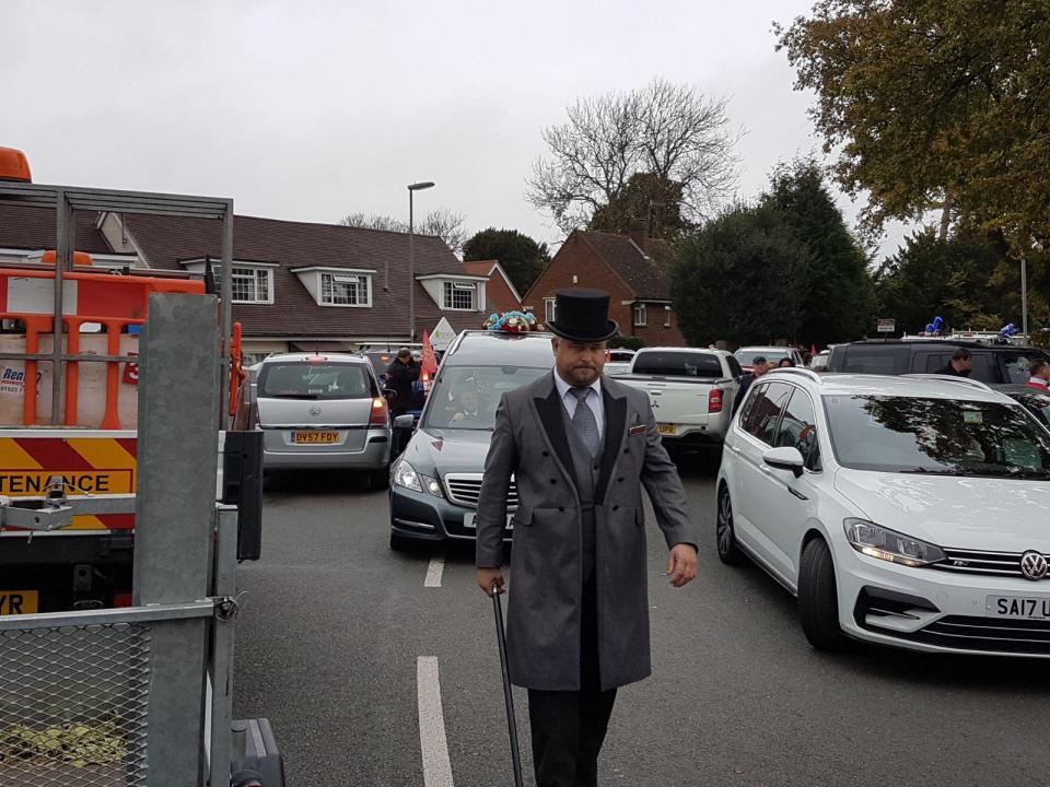  Funeral procession lines the streets of Horley in Surrey today