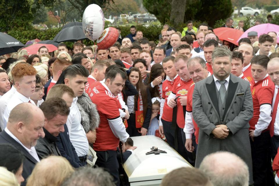  Mourners gather at Epsom Crematorium this afternoon