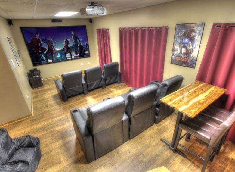  A theatre room comes with a 120-inch television screen, while other rooms contain pool tables and old school video games