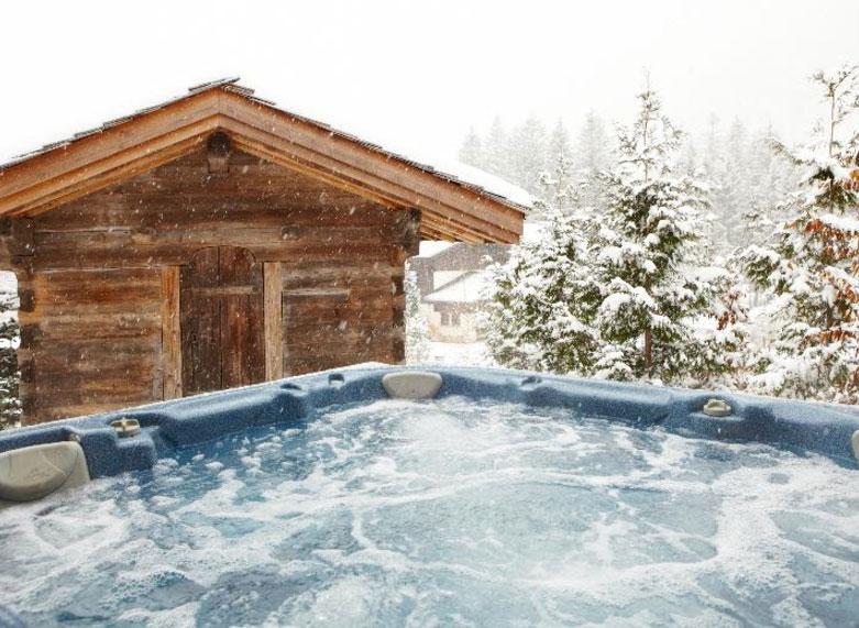  Enjoy a beer in the snow while keeping warm in the Jacuzzi at this four bedroom chalet in Chamonix