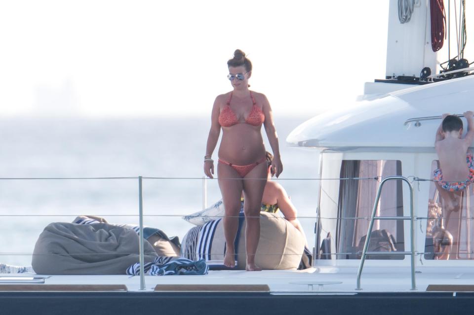  She showed off her tum in a peach two piece