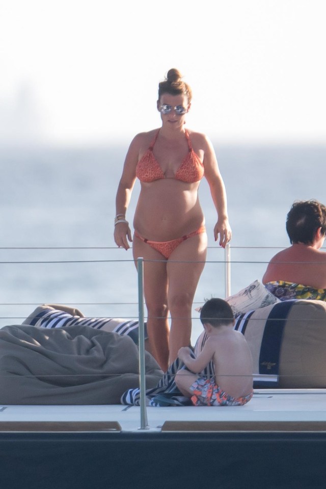 Coleen showed off her growing baby bump on holiday