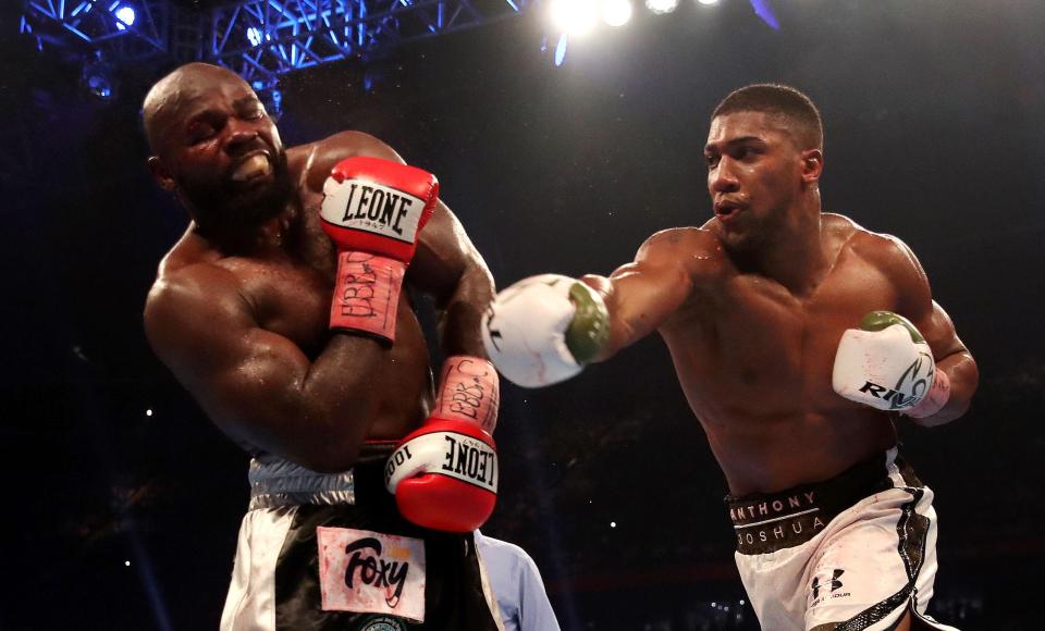  Anthony Joshua goes for the KO against stubborn Carlos Takam