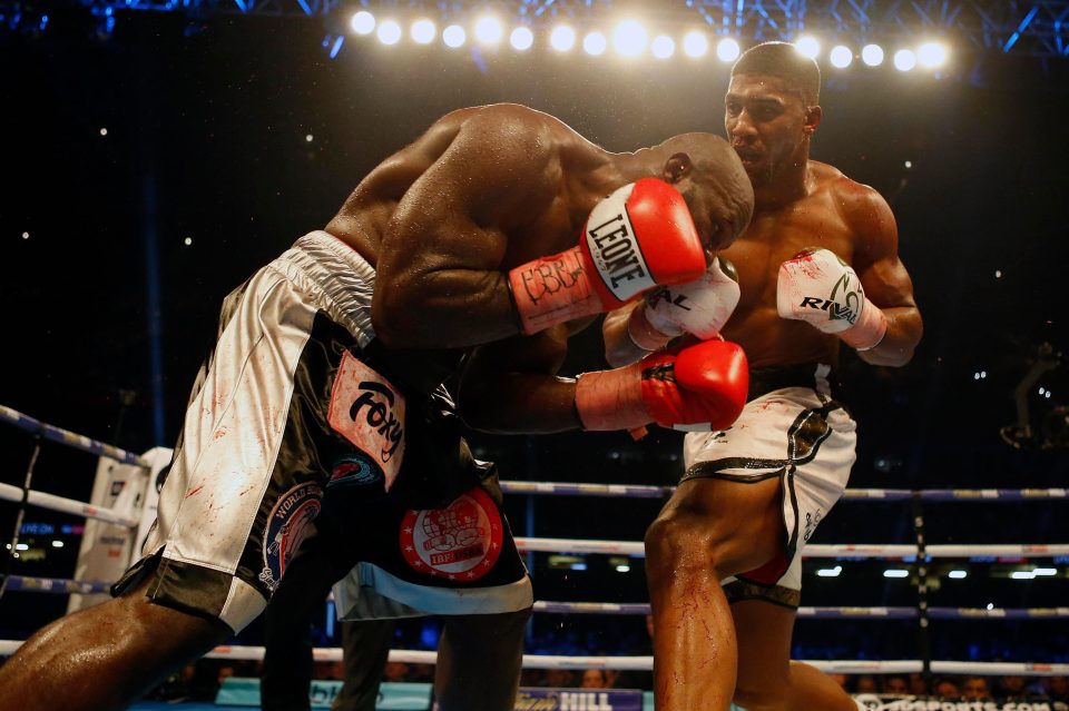  Takam withstood a barrage from champ AJ