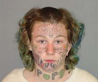  Tatts just odd. This woman appears to have had a miniature moustache or whiskers inked under her lip