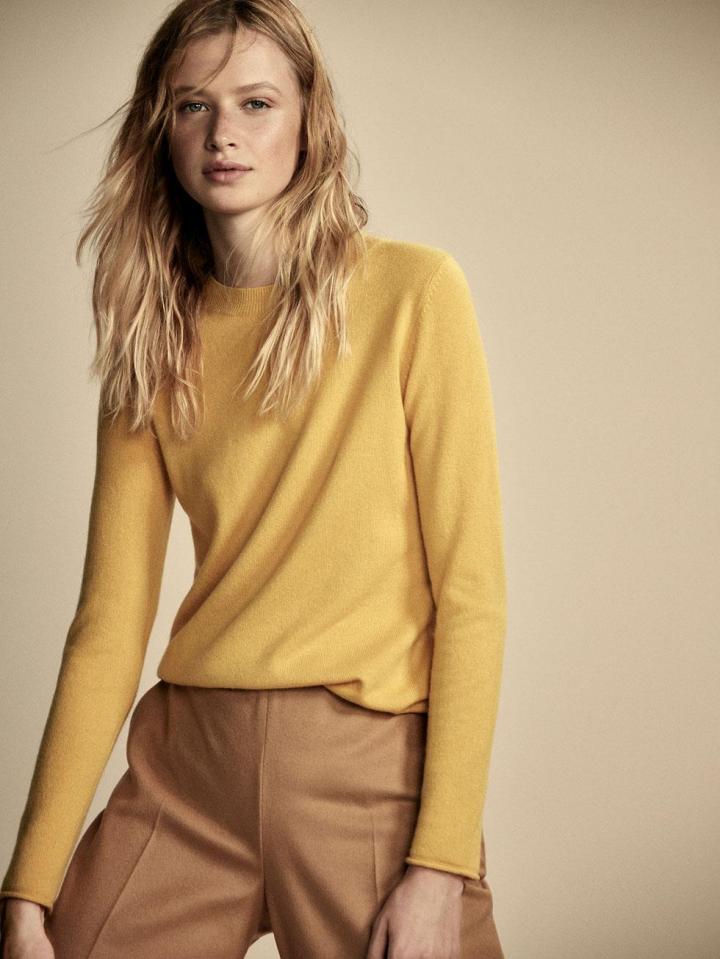  She's paired it with a mustard cashmere sweater by designer Massimo Dutti