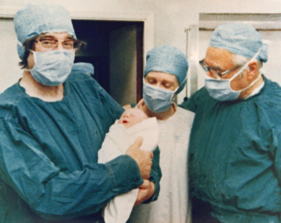  Louise on the day she was born with hospital staff