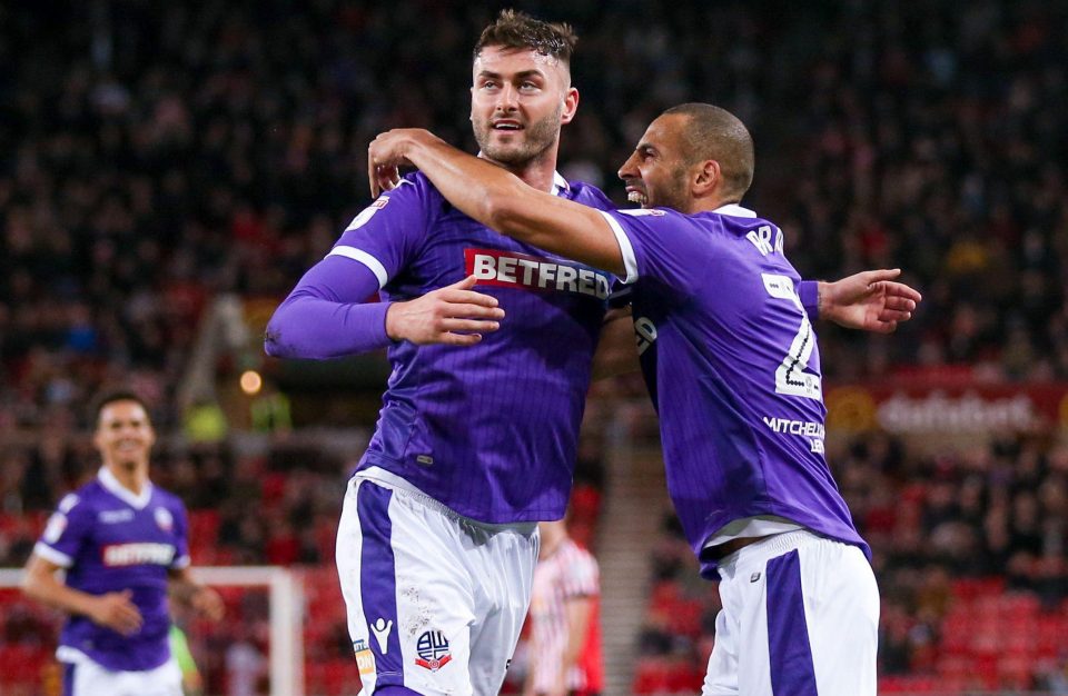 Bolton Wanderers striker Gary Madine (14) scores a goal and celebrates to make the score 2-2