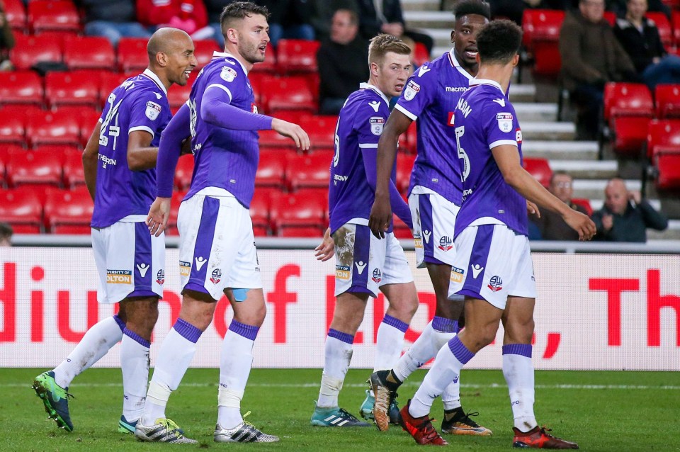 Henry celebrates his goal with team-mates