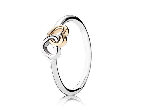 This entwined hearts ring, featuring interlocking sterling silver and 14k gold hearts to symbolise love bonds, costs £60