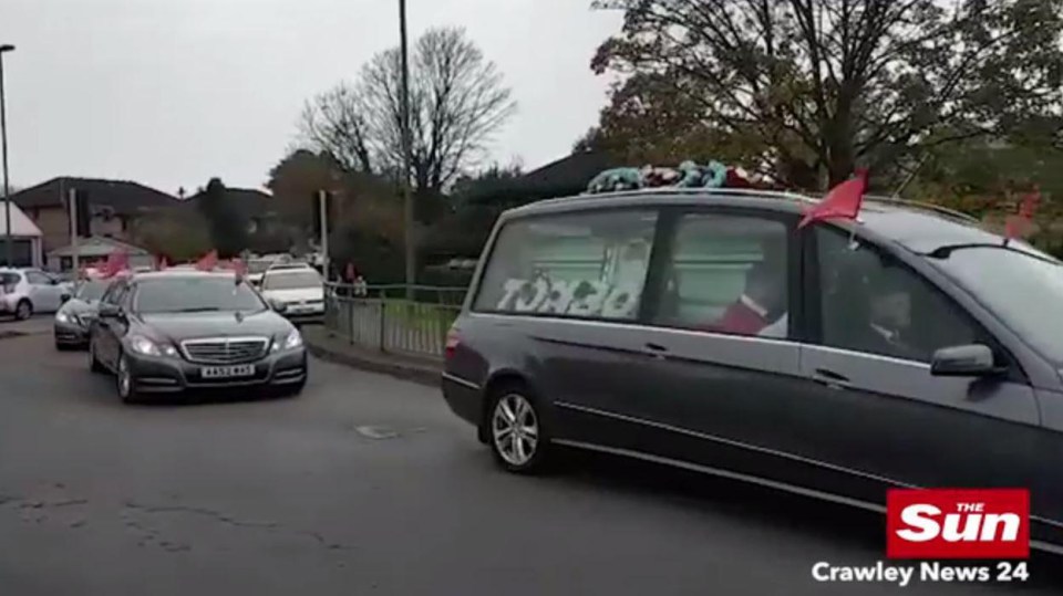 Tom Boy’s coffin is transported from the church to the crematorium this afternoon