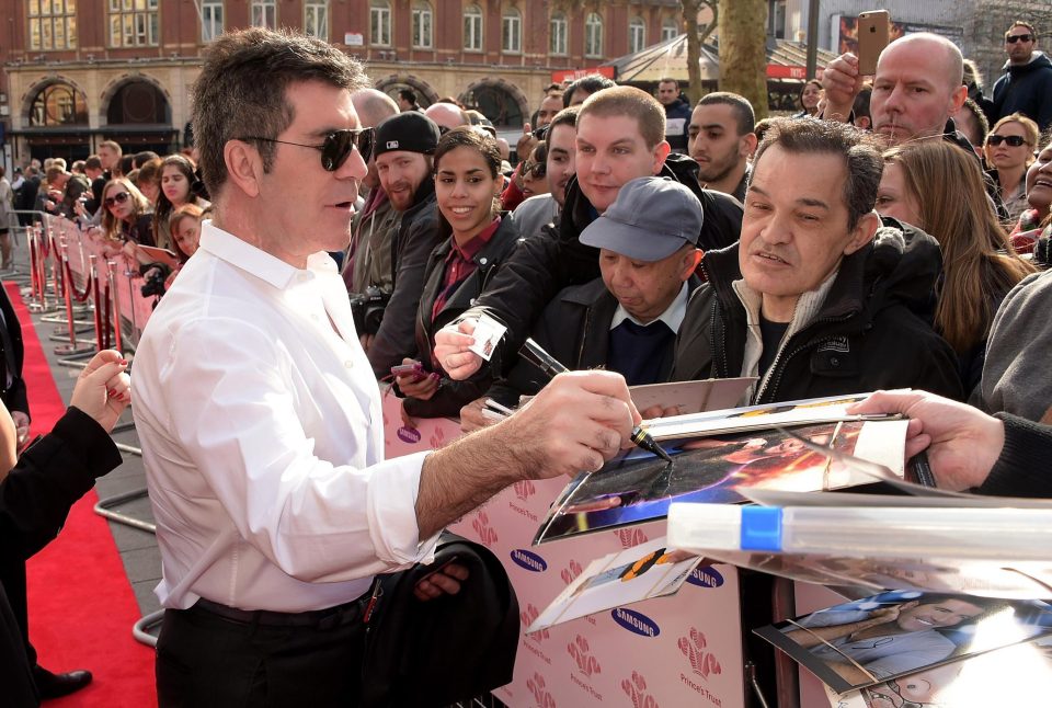  The X Factor boss signs his autograph at The Princes Trust awards in 2015