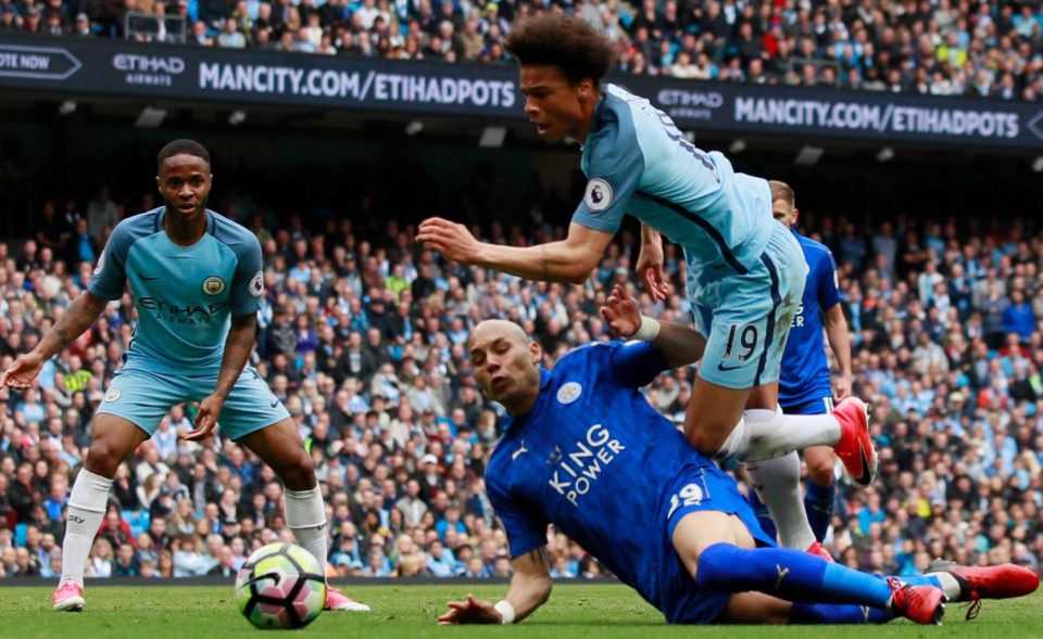  Benalouane gets a decent tackle in on Manchester City winger Leroy Sane