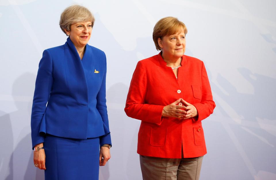  A German official has said that Chancellor Angela Merkel wants Theresa May to cave in over the EU divorce bill