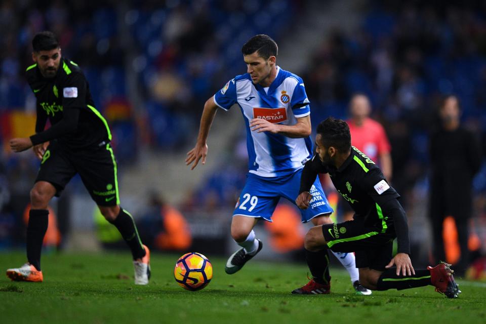  Espanyol left-back Aaron Martin is being chased by Premier League rivals Manchester United and Manchester City