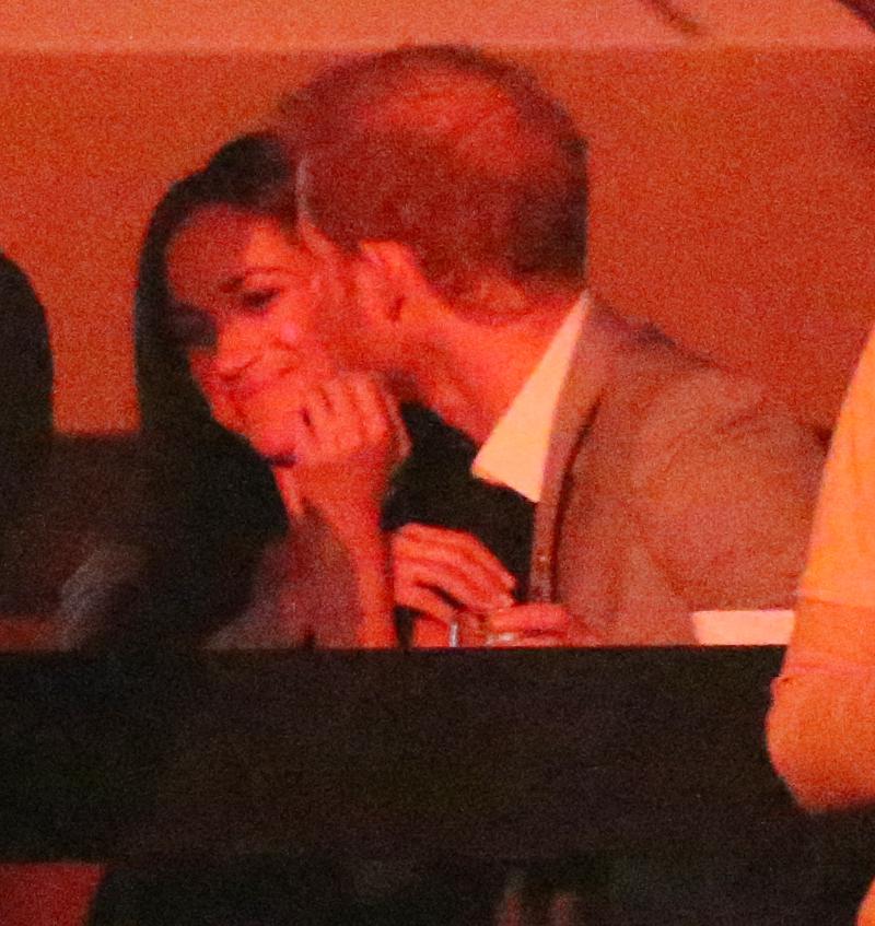  Sealed with a kiss: Harry plants a smacker on Meghan at the closing ceremony