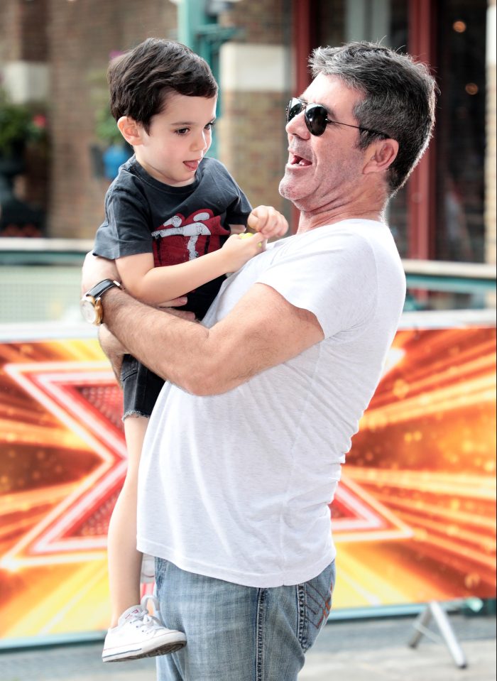  Doting dad Simon with his son Eric in July