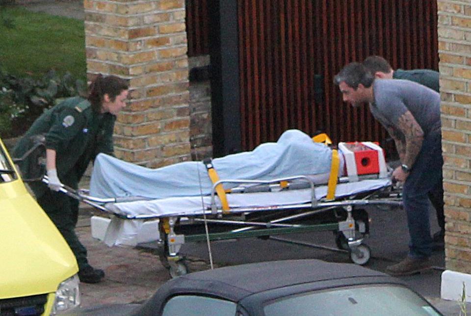  Simon being wheeled out of his house and into an ambulance after his fall