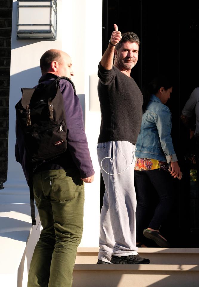  Thumbs up . . . Simon returning to his home after falling down a set of stairs