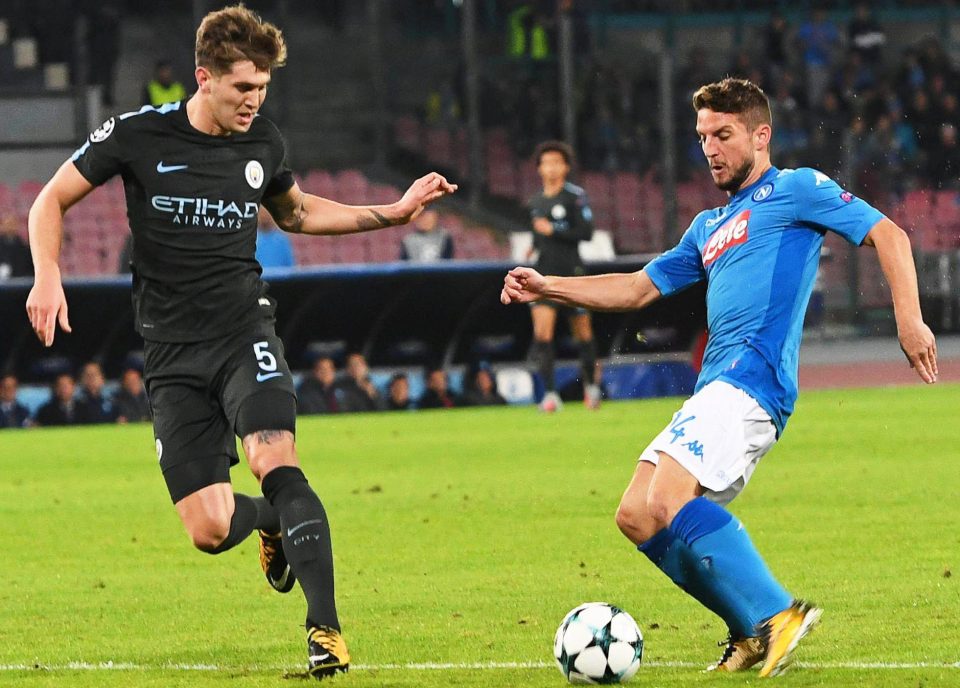  Napoli's Dries Mertens does his best to get past Stones