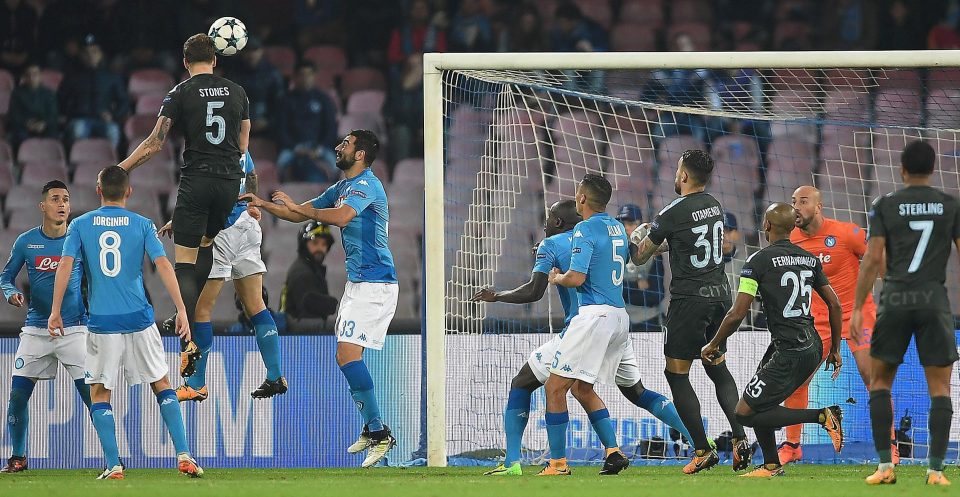  Stones heads home City's second goal against Napoli