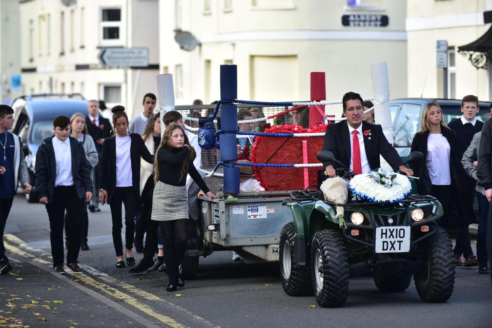 The talented 16-year-old boxer who died in a car crash was carried in a boxing ring for his funeral