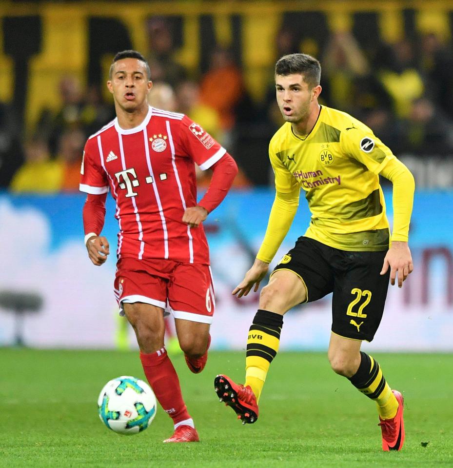  Christian Pulisic in action against Bayern ace Thiago