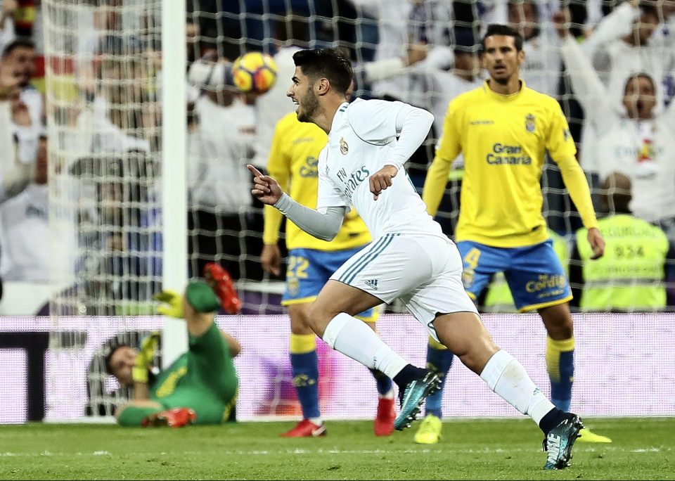 Marco Asensio turns to celebrate with his shot still nestling high in the net