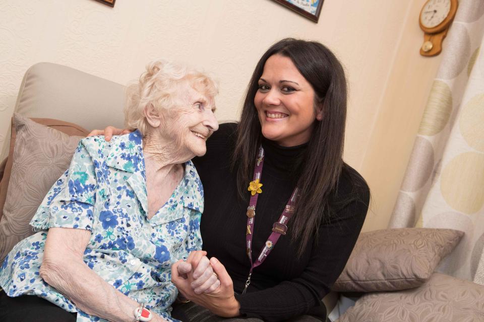  Helping hand . . . carer Suraya with client Helen