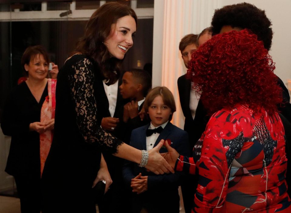  Kate looked radiant in a black lace Diane von Furstenberg dress