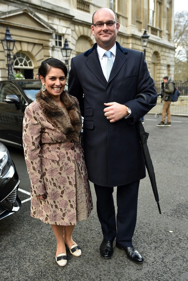 Alex Sawyer with his wife Priti Patel