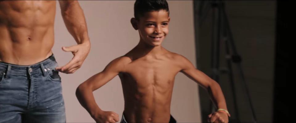  The seven-year-old tenses his muscles during the photoshoot