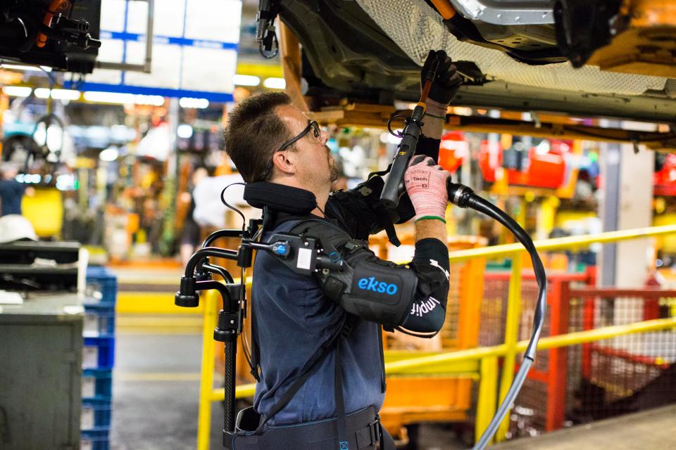  Ford have equipped their workers with bionic suits to give them added strength with overhead tasks