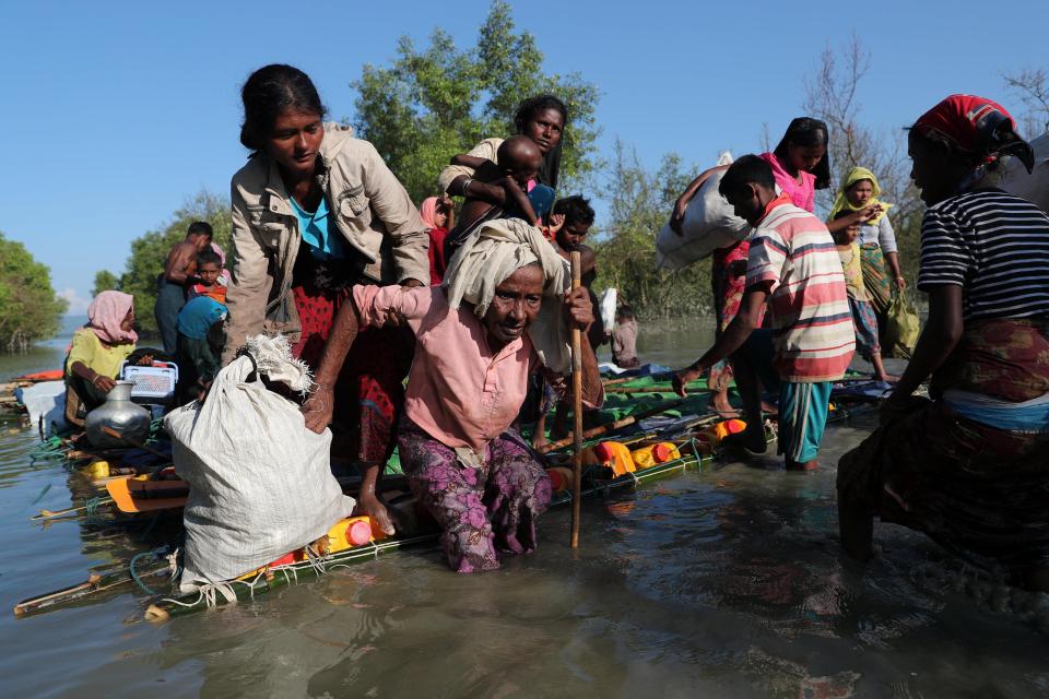  Rohingya Muslims fleeing persecution and violence in Myanmar, which Prime Minister Theresa May said 'looks like ethnic cleansing'