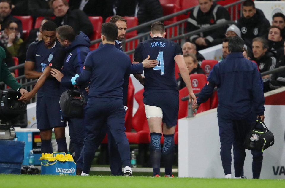  Manchester United defender Phil Jones goes off injured during the first half at Wembley