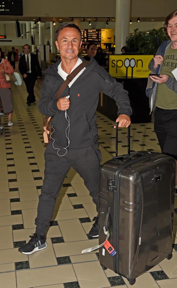  Dennis Wise, the latest camper to sign up, was also spotted at Brisbane airport