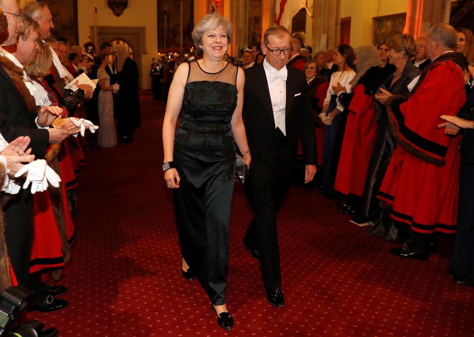  Mrs May was applauded as she arrived at the annual event with husband Philip