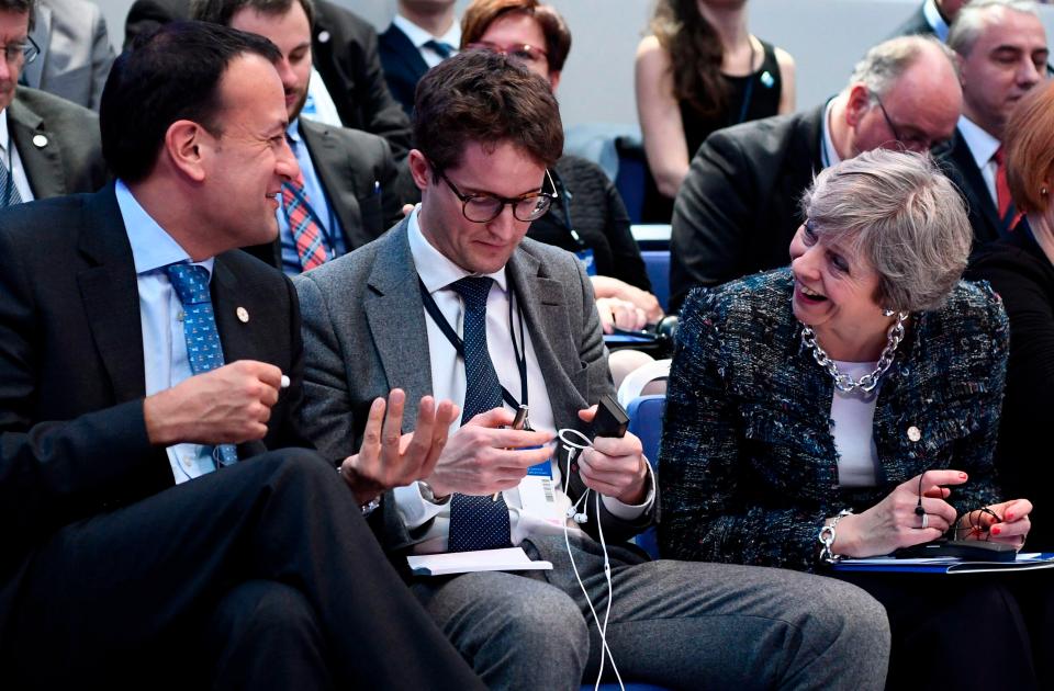  The PM waits for the start of a round-table talk this morning