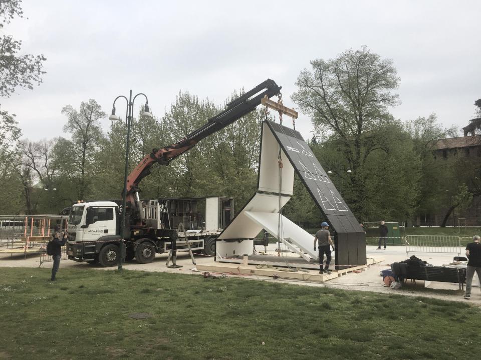  Time-lapse footage shows the modern prefab home being transformed into the final product, complete with windows and doors