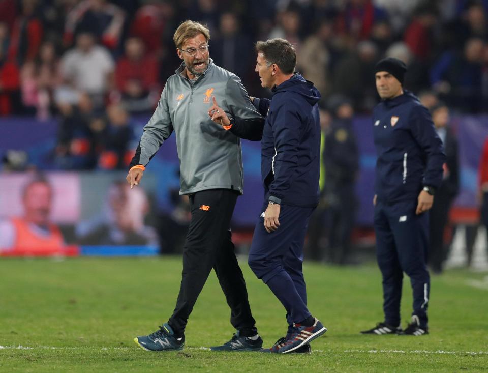 Liverpool boss Jurgen Klopp talks to Sevilla manager Eduardo Berizzo after the game